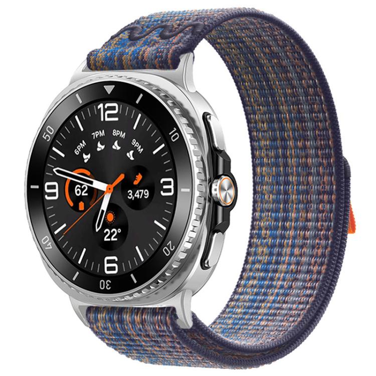 Nylon hook-and-loop watch band in royal blue with orange flecks, shown on a silver watch.