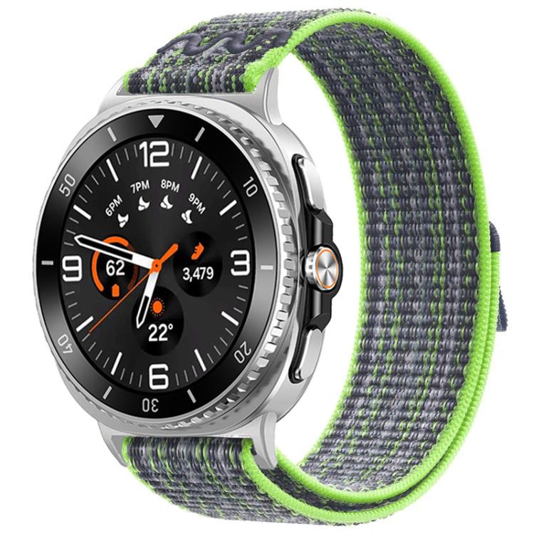 Nylon hook-and-loop watch band in gray with lime green trim, shown on a silver watch.