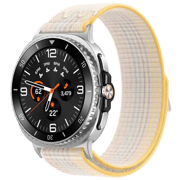 Nylon hook-and-loop watch band in pale cream with yellow trim, shown on a silver watch.