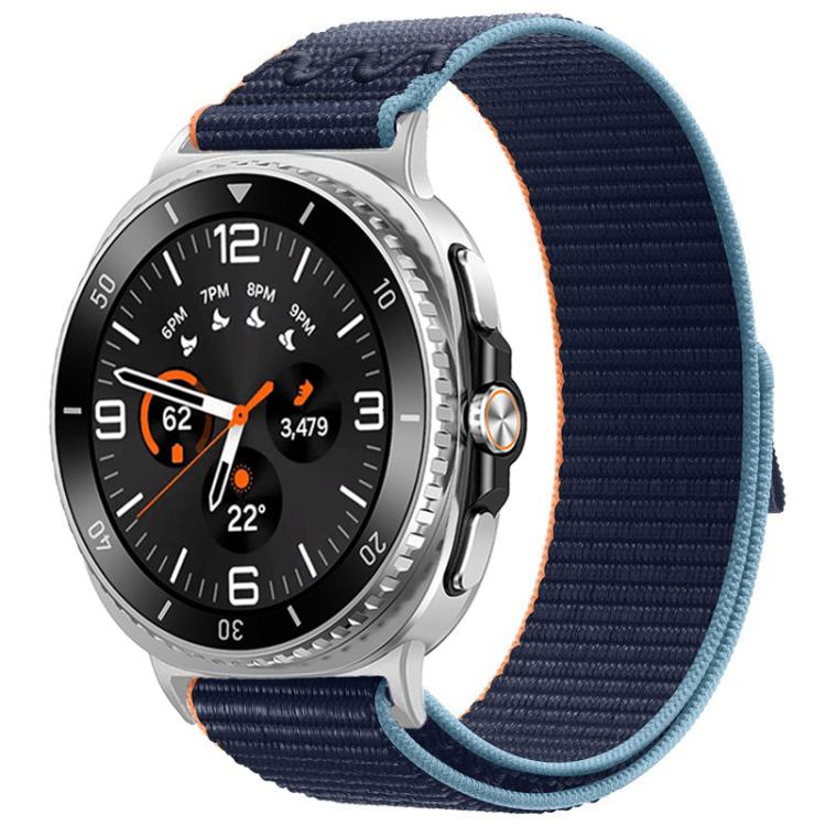 Nylon hook-and-loop watch band in dark navy with light blue trim, shown on a silver watch.