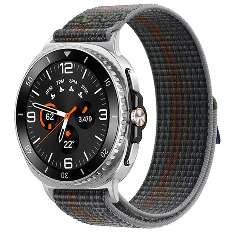 Nylon hook-and-loop watch band in charcoal gray with multicolor flecks, shown on a silver watch.
