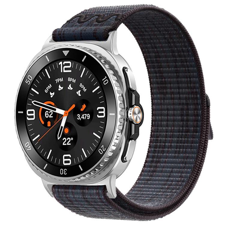 Nylon hook-and-loop watch band in dark navy and black, shown on a silver watch.