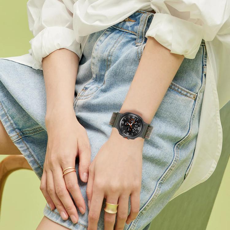 Dark woven nylon watch band worn on a wrist with a black Galaxy watch