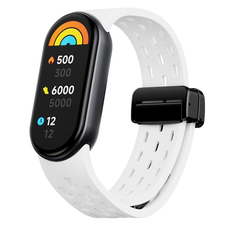 White perforated silicone watch band with black magnetic clasp, shown with a fitness tracker from the front