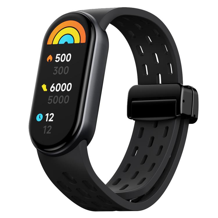 Black perforated silicone watch band with matching magnetic clasp, shown with a fitness tracker