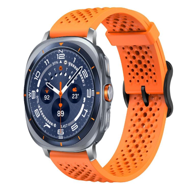 Orange perforated silicone watch band with buckle, shown attached to a smartwatch