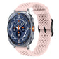 Pink perforated silicone watch band with buckle, shown attached to a smartwatch