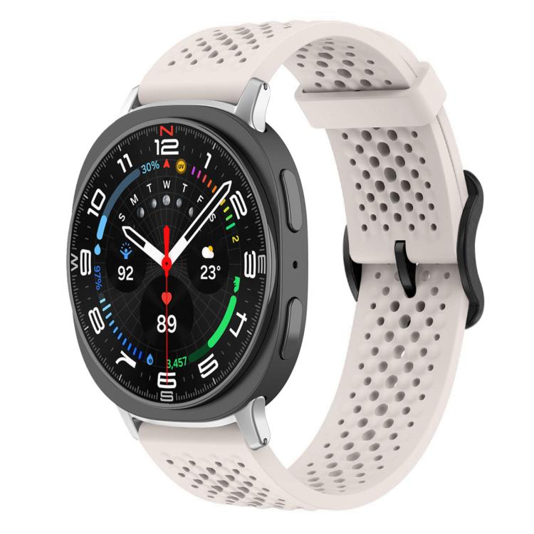 Pale pink perforated silicone watch band with a round smartwatch