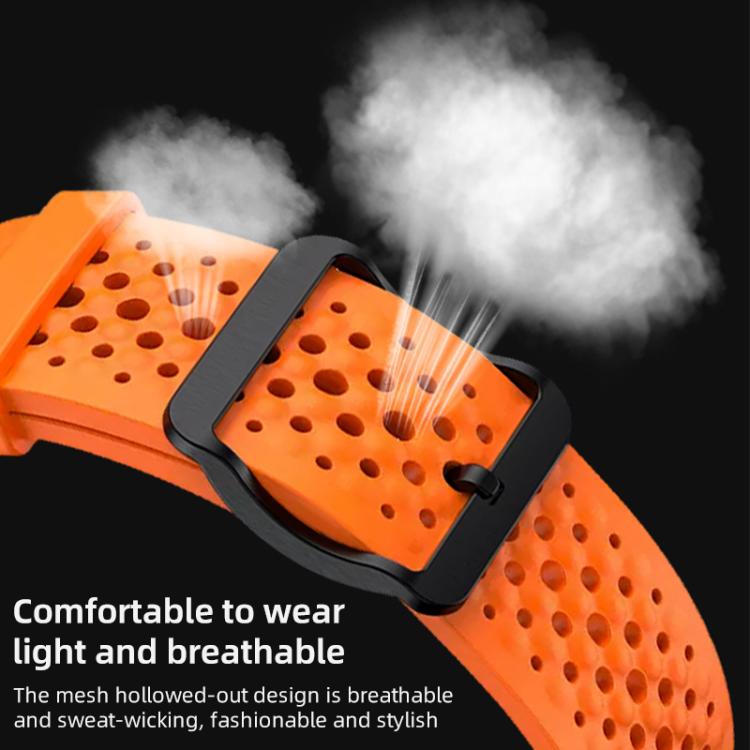 Close-up of orange perforated silicone watch band and black buckle