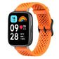 Orange perforated silicone watch band on a black smartwatch
