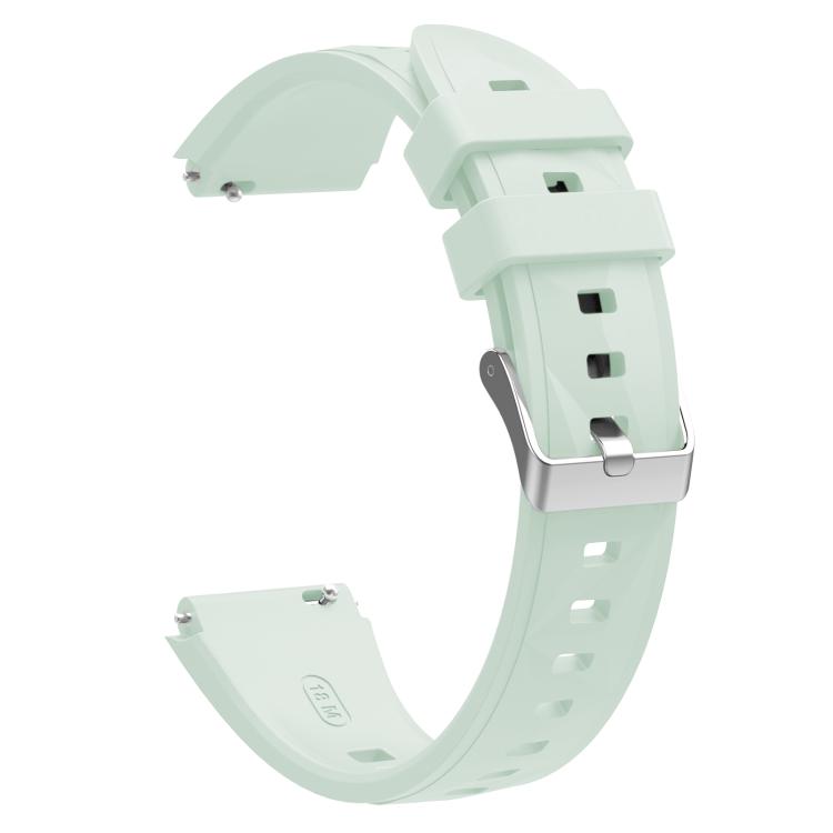 Pale mint silicone watch band with adjustable holes and silver buckle, shown from the back