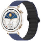 Two-tone glossy silicone watch band in dark blue and black, shown on a smartwatch.
