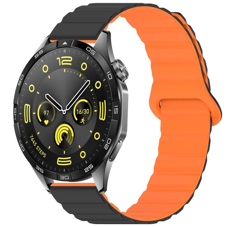 Two-tone glossy silicone watch band in black and orange, shown on a smartwatch.