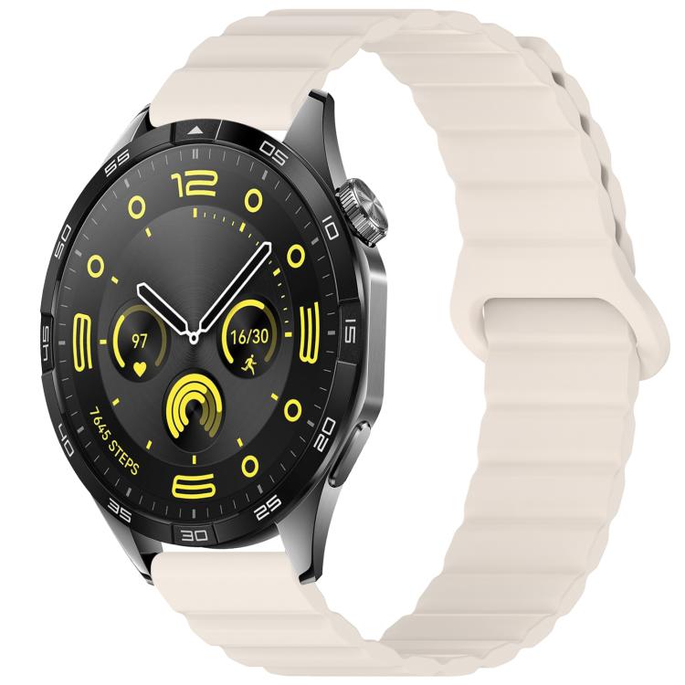 Ivory silicone watch band with a magnetic loop closure, shown on a watch.