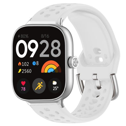 White perforated silicone sport watch band with silver buckle on a silver smartwatch