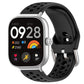 Black perforated silicone sport watch band with silver buckle on a smartwatch