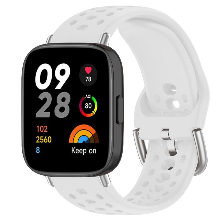 White perforated silicone sport watch band with silver buckle on a black smartwatch