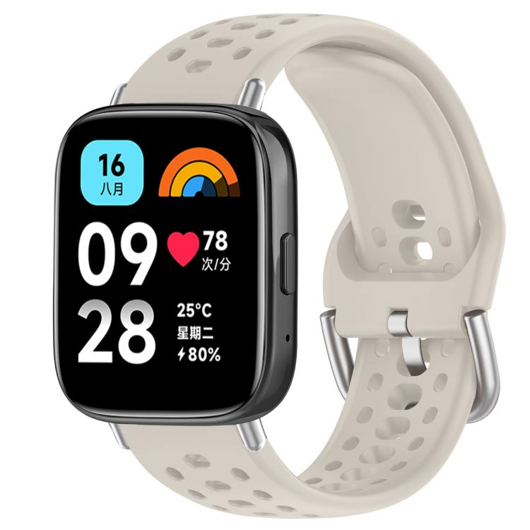Off-white perforated silicone sport watch band with silver buckle, shown on a smartwatch
