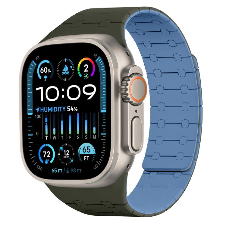 Apple Watch with a two-tone silicone band, dark green on one side and blue on the other