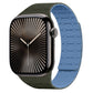 Apple Watch with a dark green and blue two-tone silicone band