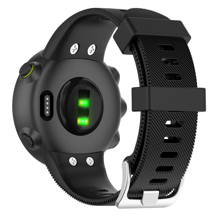Back of a black silicone watch band with textured, perforated strap and metal buckle.