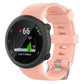 Light pink silicone watch band with ribbed texture, shown attached to a round watch.