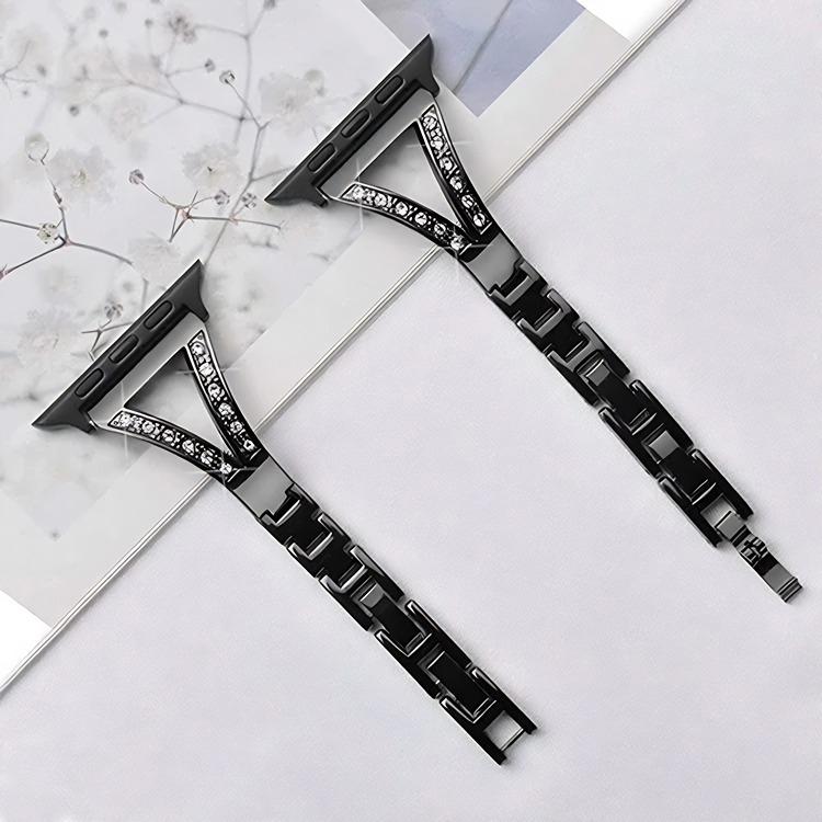 Black stainless steel watch band pair with herringbone links and crystal-accented connector sections