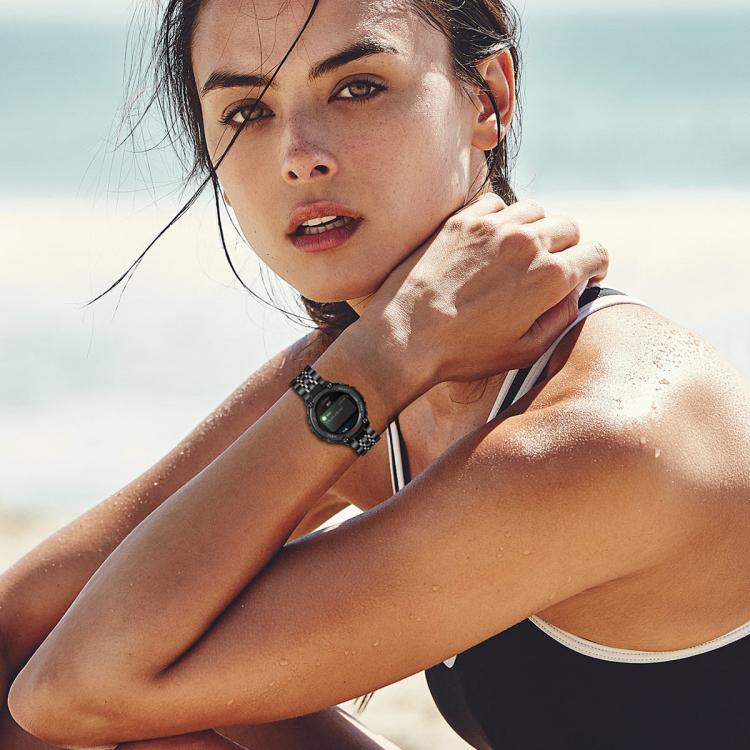 Black stainless steel linked watch band worn on the wrist
