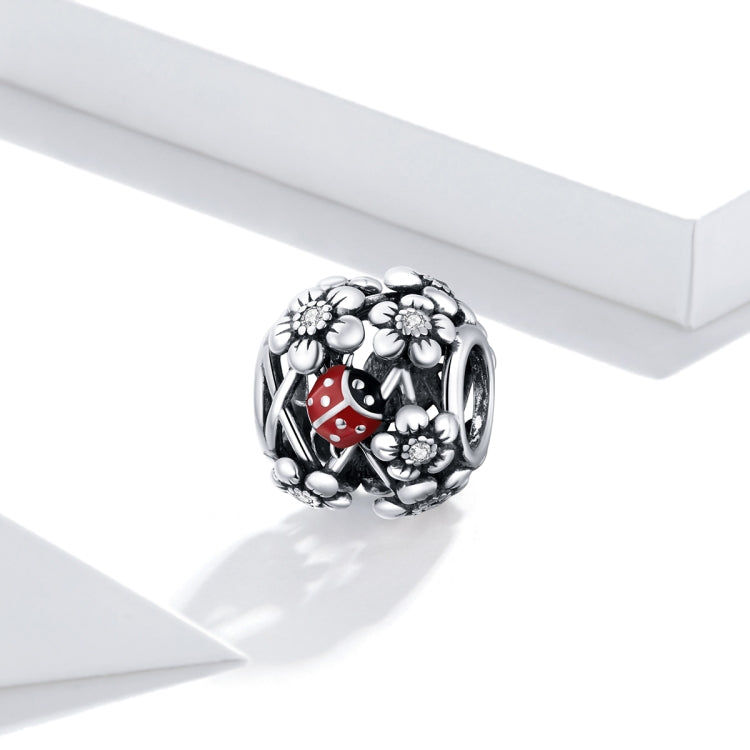 Sterling silver S925 charm bead with ladybug red enamel and floral accents.