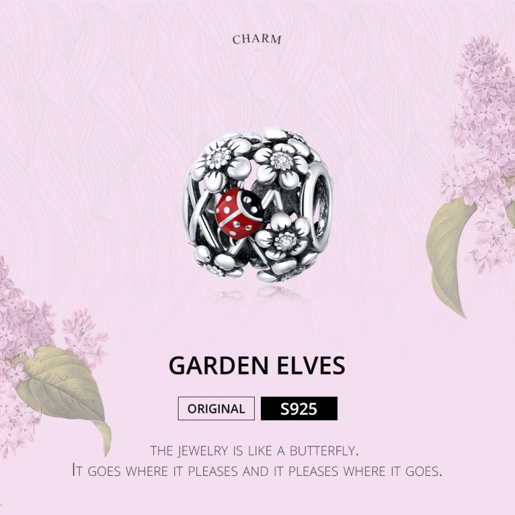 Garden elves charm bead: silver filigree with red ladybug enamel and flowers.