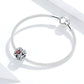 Silver charm bracelet with S925 ladybug filigree bead featuring red enamel.