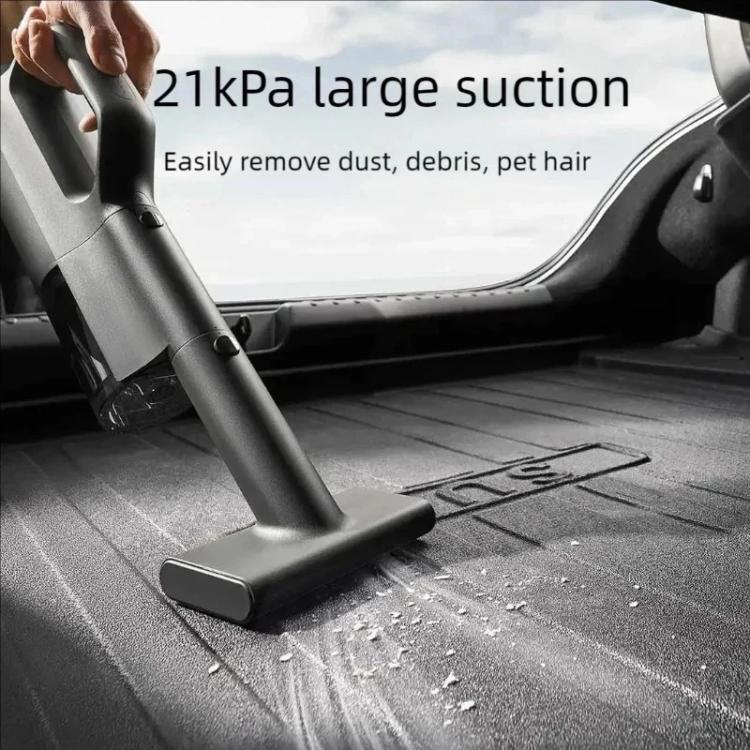 Handheld car vacuum cleaner using a flat floor nozzle on a car seat