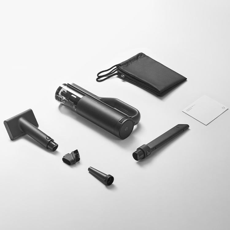 Handheld car vacuum kit with storage pouch, floor brush, crevice nozzle, and spare parts