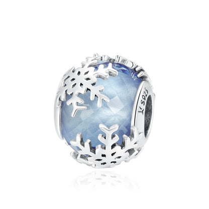 S925 sterling silver snowflake charm bead with blue glass center and cutout snowflakes