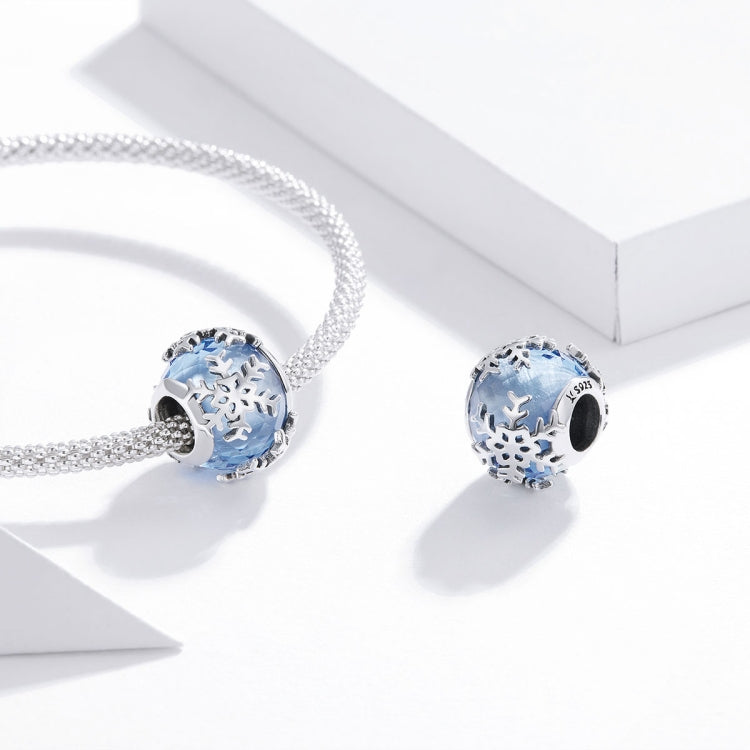 Silver chain bracelet with blue snowflake charm bead centerpiece