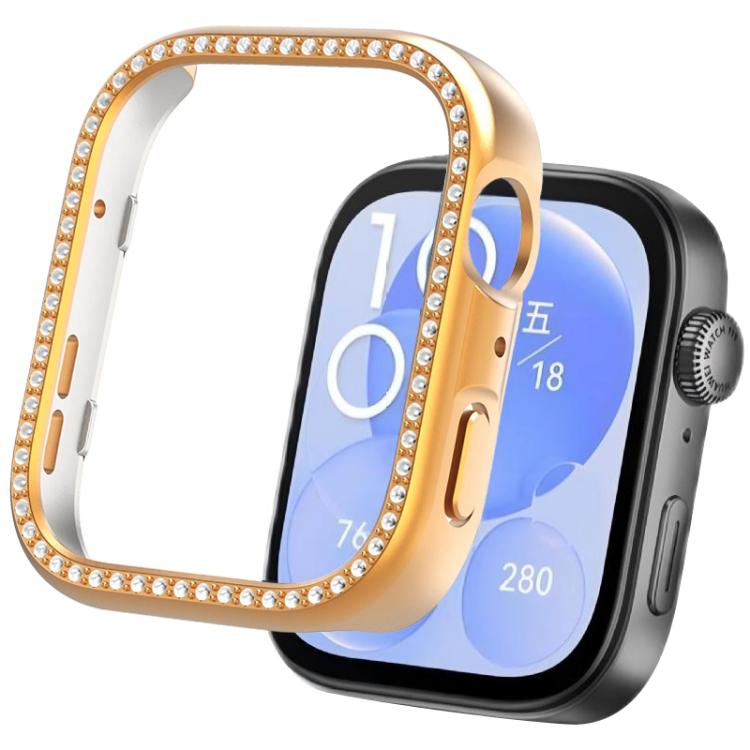 Rose gold smartwatch protective cover with crystal trim beside a watch