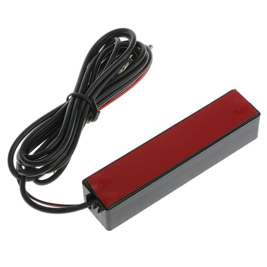 Black antenna amplifier module with red and black wiring bundle