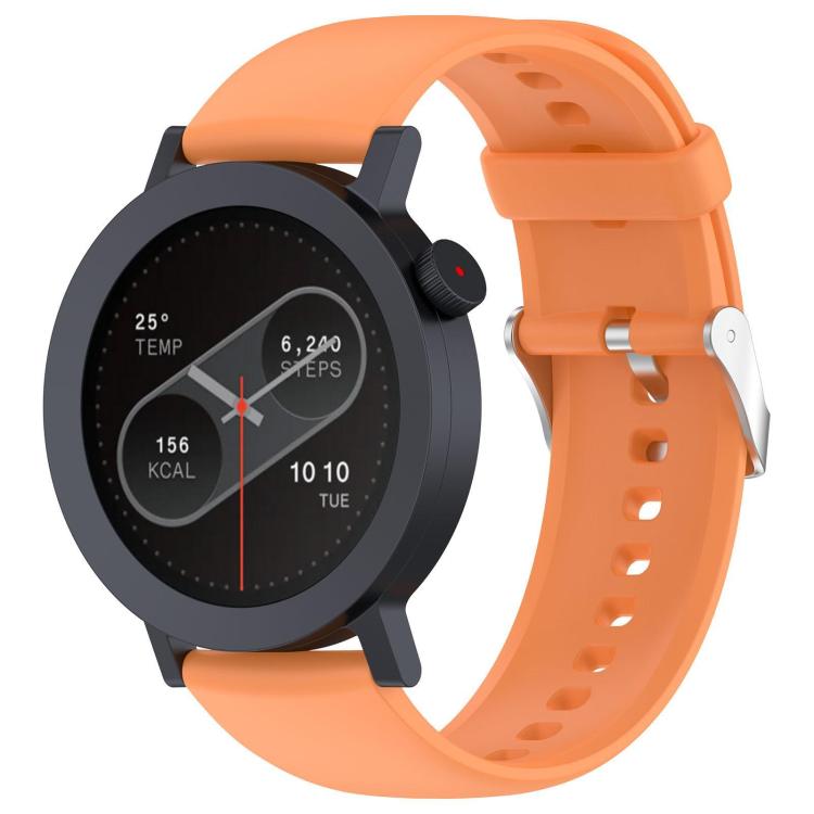 Bright orange silicone watch strap with sizing holes and metal buckle, fitted to a round smartwatch.