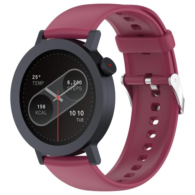 Burgundy silicone watch strap with sizing holes and metal buckle, fitted to a round smartwatch.