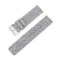 Gray woven nylon watch band with silver pin buckle and adjustment holes