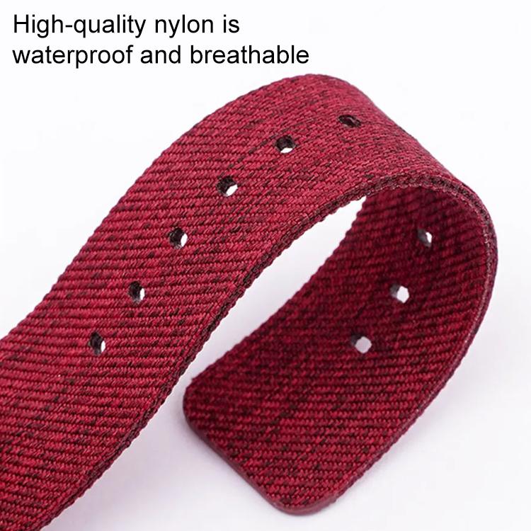 Red woven nylon watch band with adjustment holes and a flexible curve