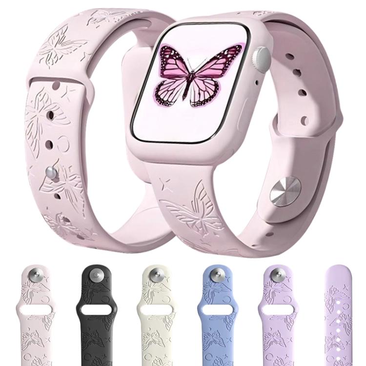 Butterfly-engraved silicone Apple Watch band in pale pink, shown on a watch and in five colors.