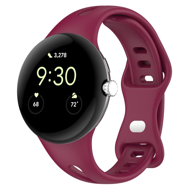 Wine red silicone watch band fitted to a smartwatch, with adjustment holes and a loop buckle.