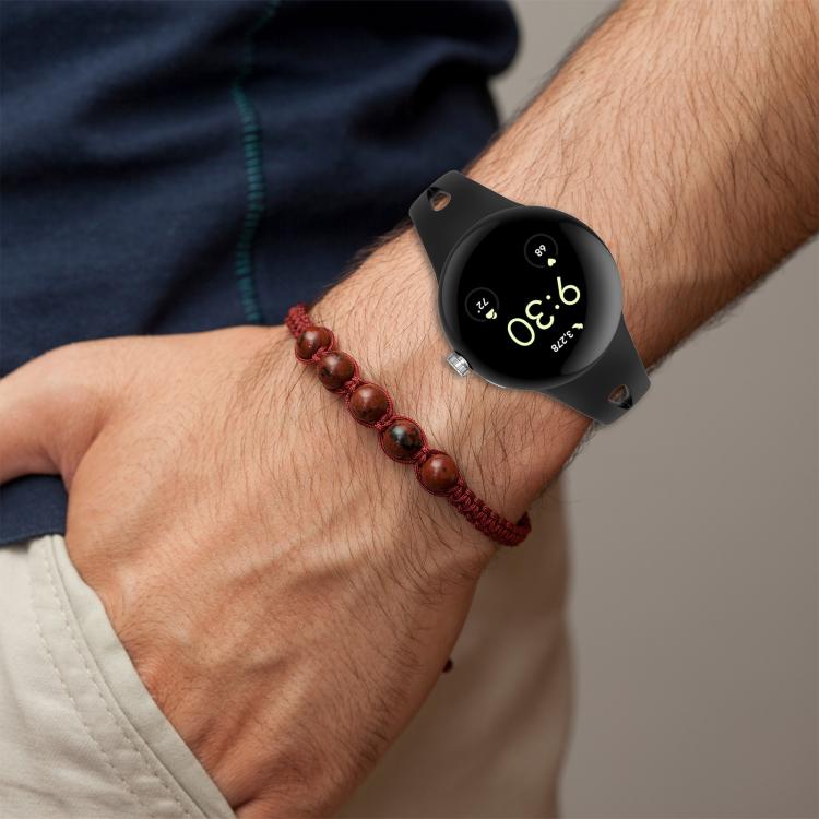 Black silicone watch band worn on a wrist with a smartwatch.