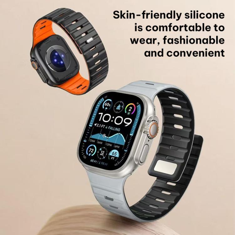 Black and orange silicone watch band with slotted strap on a smartwatch