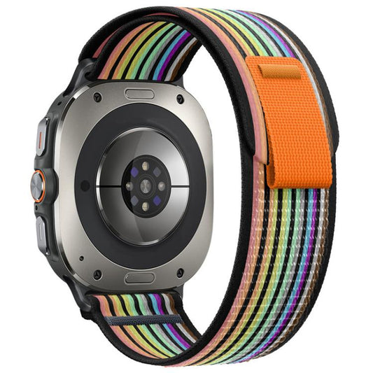 Black nylon watch band with multicolor stripes and an orange closure tab