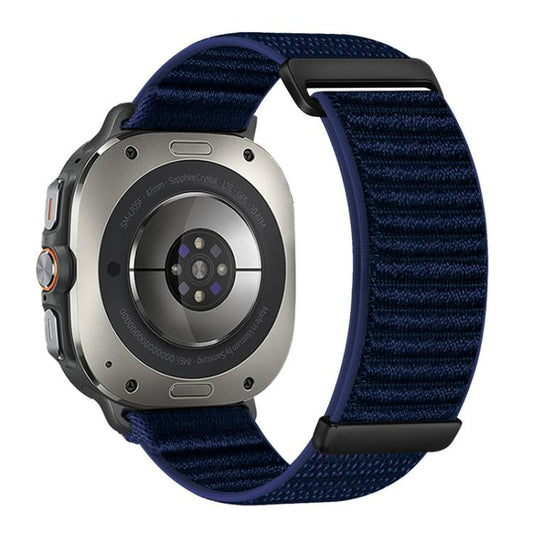 Navy two-piece mountain-pattern nylon watch band with black hardware, shown on a smartwatch.