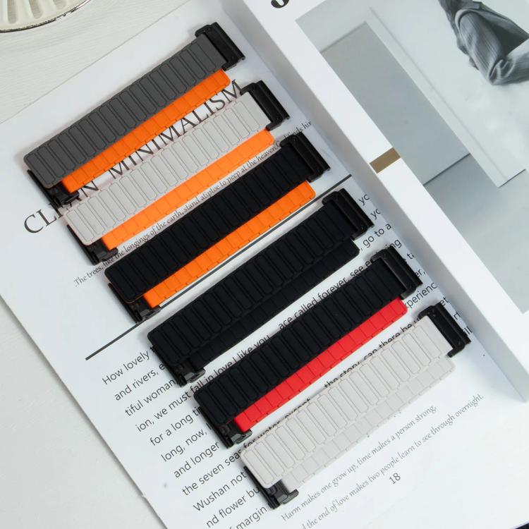 Silicone watch bands with segmented links in black, gray, and light gray, with orange or red accents