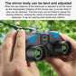 Black binoculars being adjusted, showing green objective lenses and eyepieces