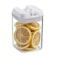 Food storage container set with clear body and white lid, holding sliced lemon rounds